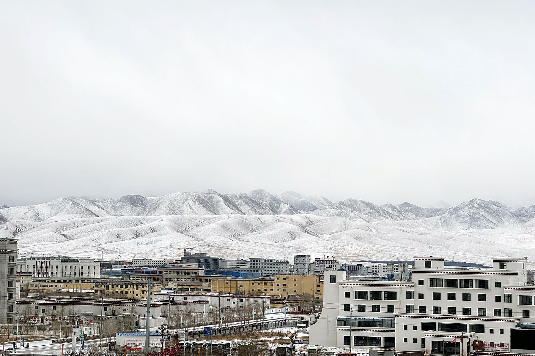 Shiquanhe and the surrounding mountains during snowfall