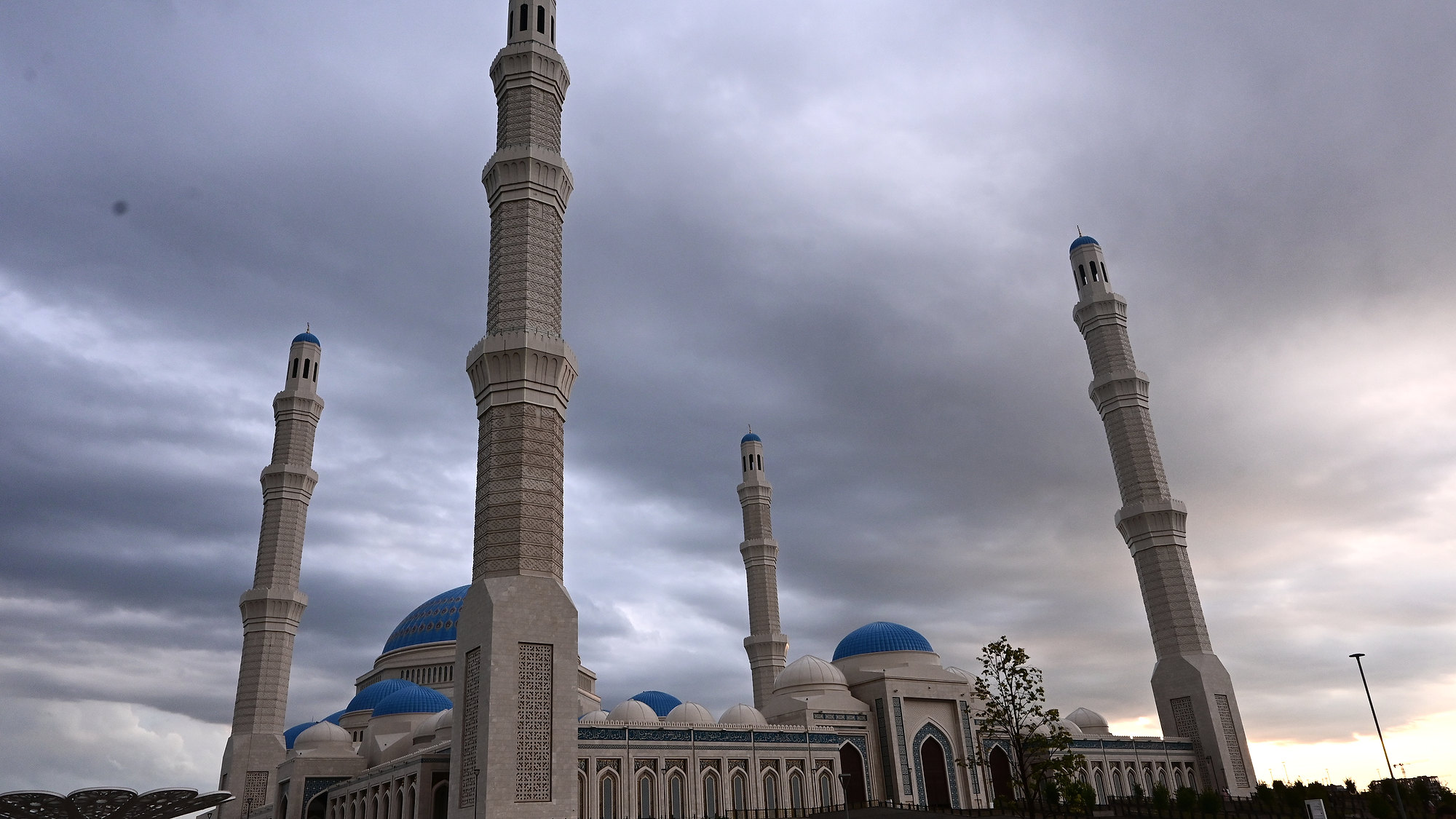 The Astana Grand Mosque and its minarets beneath dark clouds