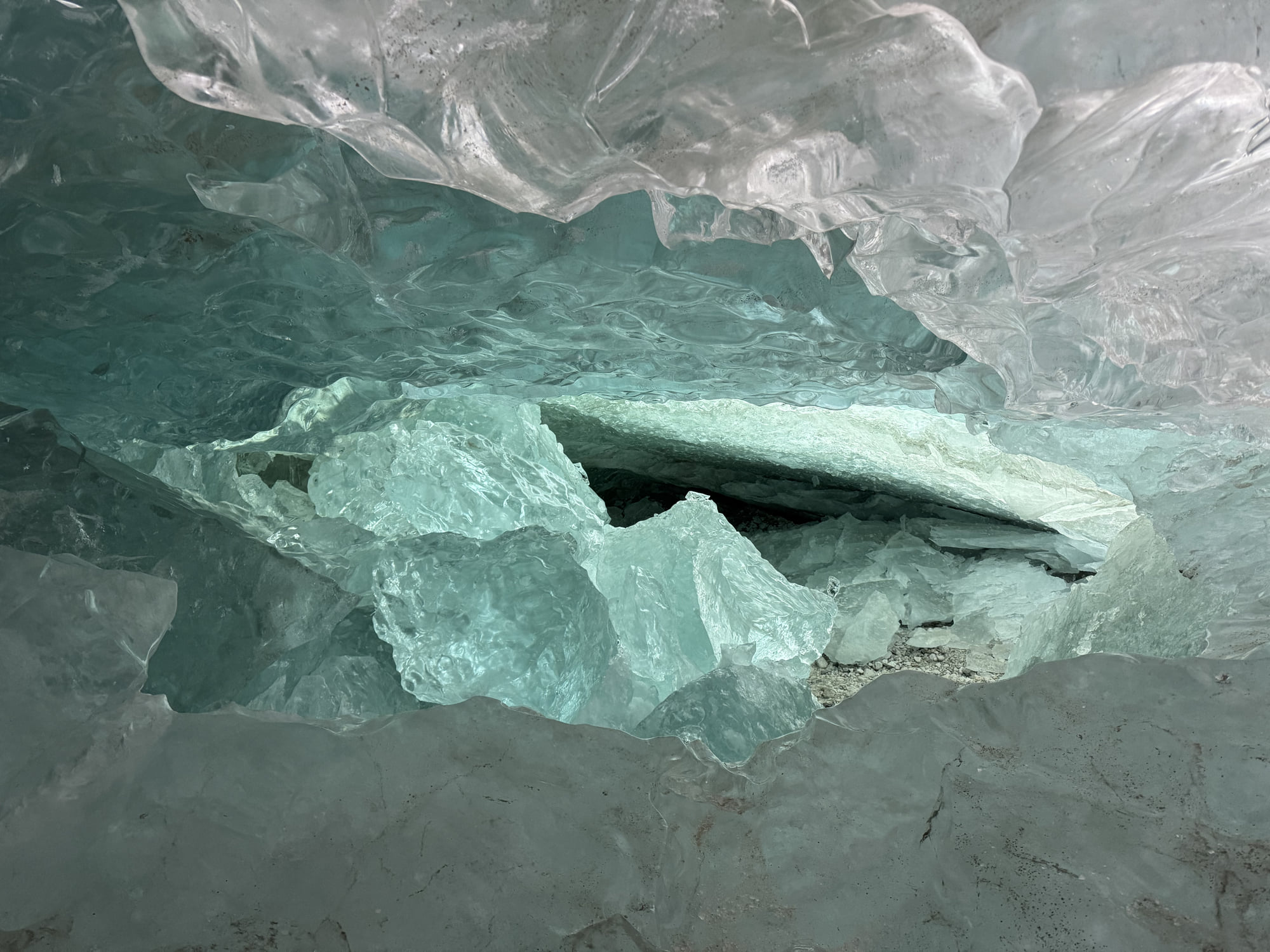 Layers, fractures, and broken ice inside blue-green ice