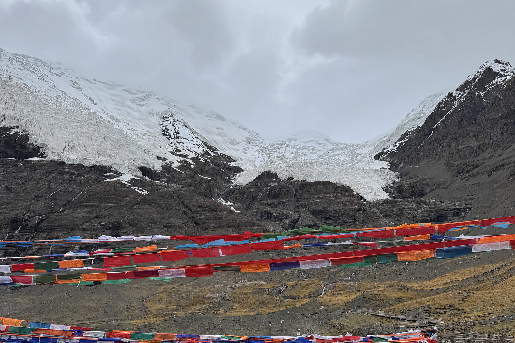 Karola Glacier lying close to the ridge beneath cloud